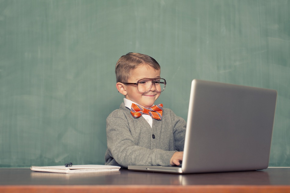 Kid on computer with glasses