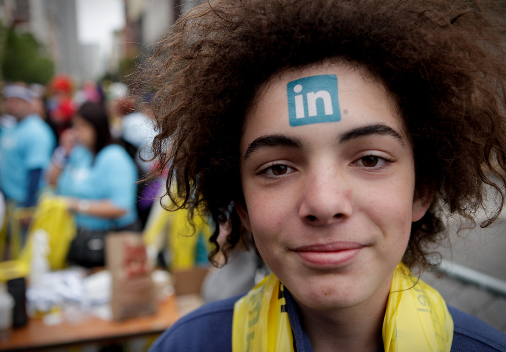 Girl with LinkedIn Stamp on forehead