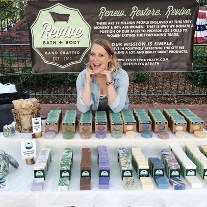 Caitlin Abshier at a farmer's market selling Cait + Co soap